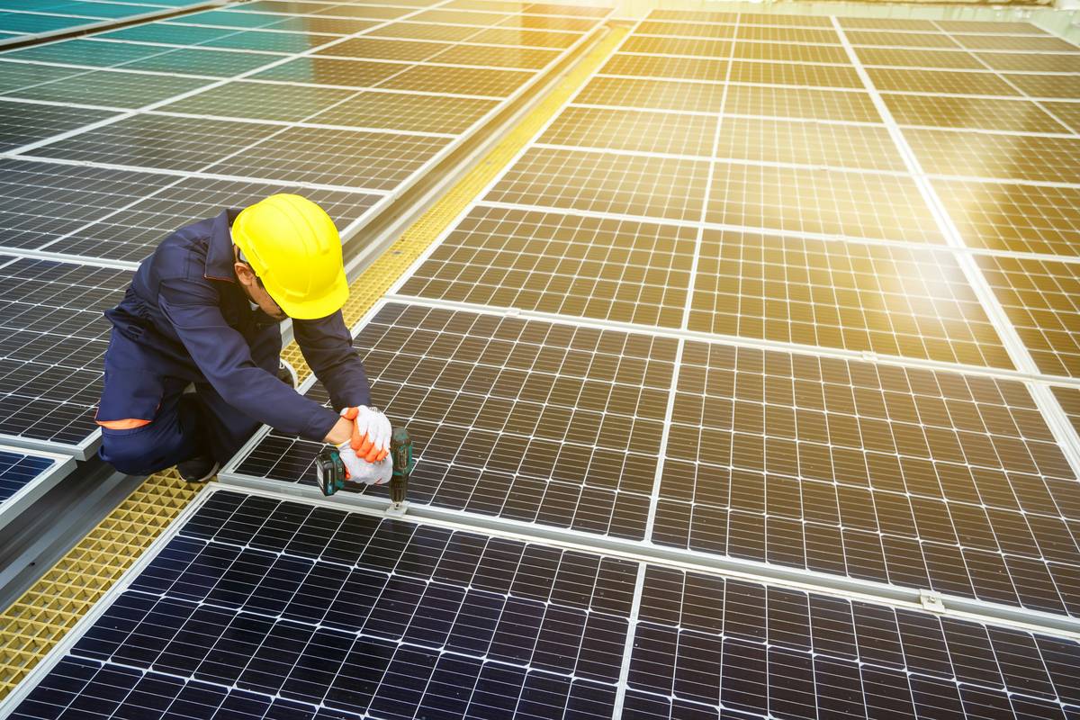 Certified solar panel installer wiring inverter during what is a solar panel installer process